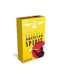 Pack of American Spirit Gold cigarettes in a bright yellow box with the brand’s Native American logo on the front and “Gold” labeling indicating full-bodied tobacco blend.